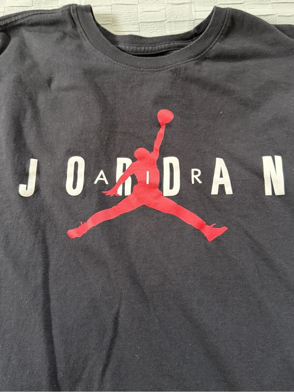 Jordan Black Short Sleeve Tee with Red Jumpman and White Lettering
